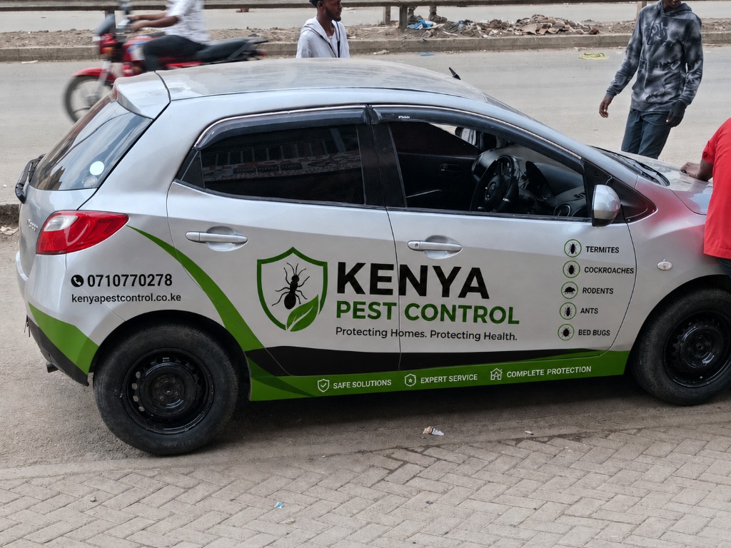 Kenya Pest Control branded service vehicle with contact details and service list